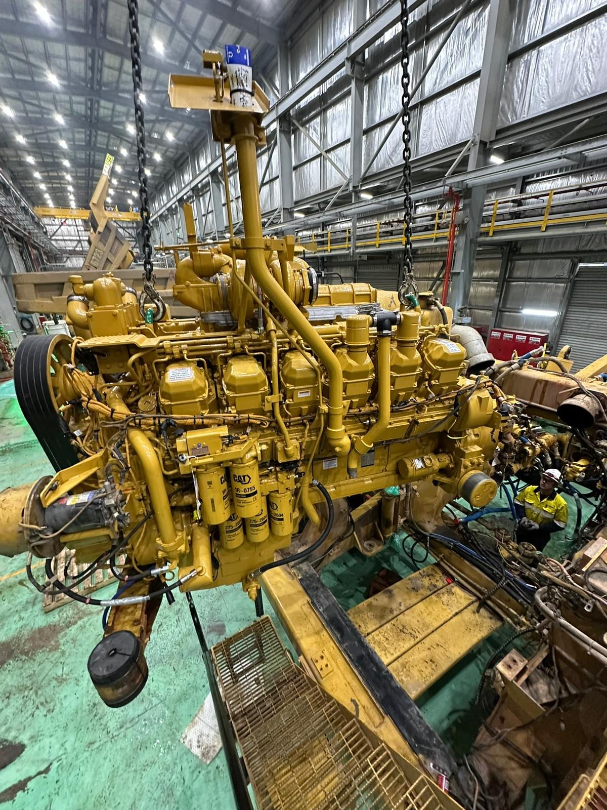 Rebuilt Caterpillar engine on a stand in the Bunbury workshop