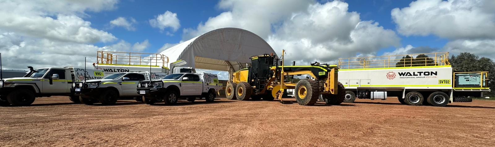 Walton Mechanical service utes, grader and service truck lined up